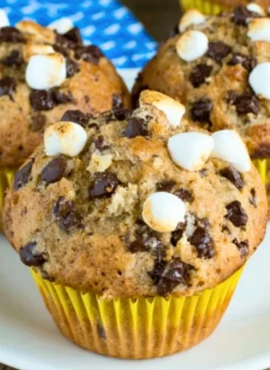 Delicious Banana S'mores Muffins topped with chocolate and marshmallows