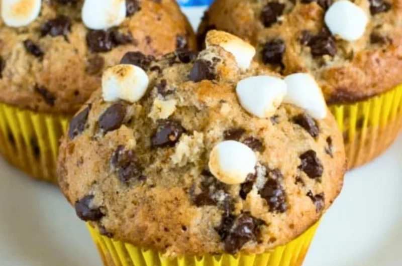Delicious Banana S'mores Muffins topped with chocolate and marshmallows