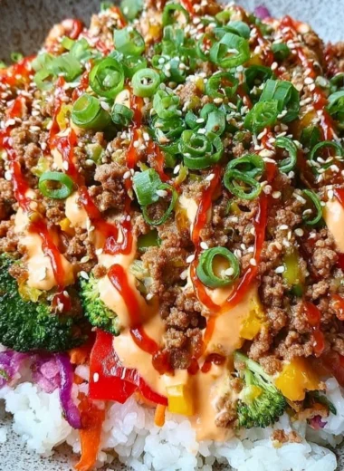 Bang Bang Ground Turkey Rice Bowl topped with vegetables and sauce
