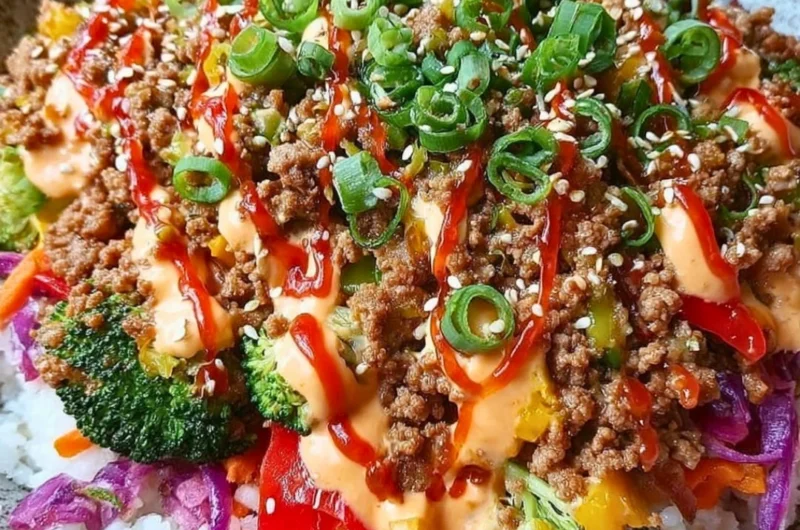 Bang Bang Ground Turkey Rice Bowl topped with vegetables and sauce