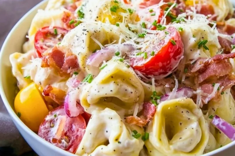 Delicious and colorful grinder tortellini salad with fresh vegetables and dressing