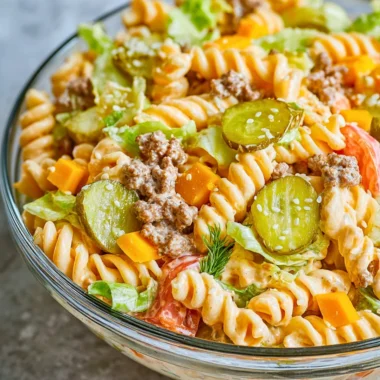 Big Mac Pasta Salad featuring ground beef, cheese, and salad ingredients in a bowl