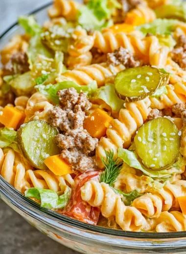 Big Mac Pasta Salad featuring ground beef, cheese, and salad ingredients in a bowl