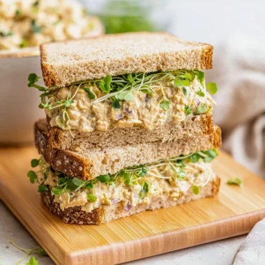 Chickpea salad sandwich with fresh vegetables on a plate