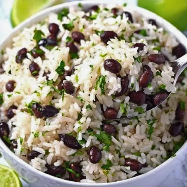 Cilantro lime rice served with black beans for a flavorful meal.