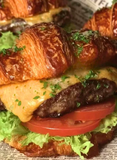 Delicious croissant smash burgers with juicy patties and toppings