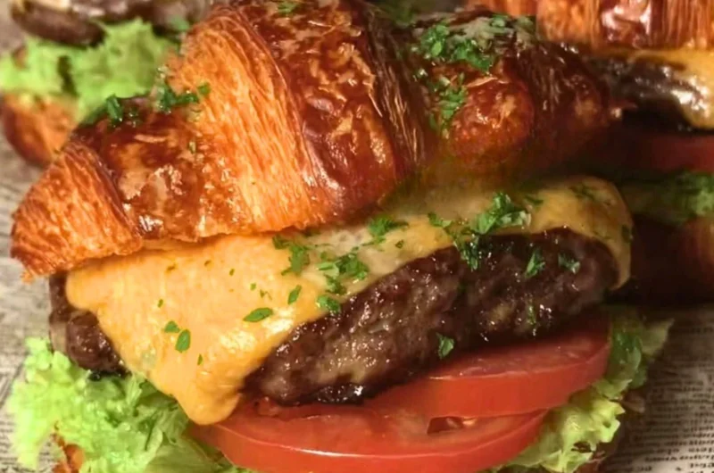 Delicious croissant smash burgers with juicy patties and toppings