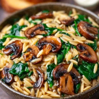 Delicious Garlic Butter Orzo with Mushrooms and Spinach served in a bowl