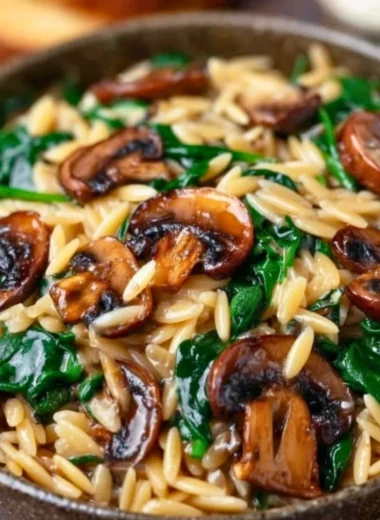 Delicious Garlic Butter Orzo with Mushrooms and Spinach served in a bowl