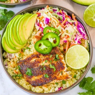 Healthy low carb fish taco bowls with fresh ingredients and vibrant toppings