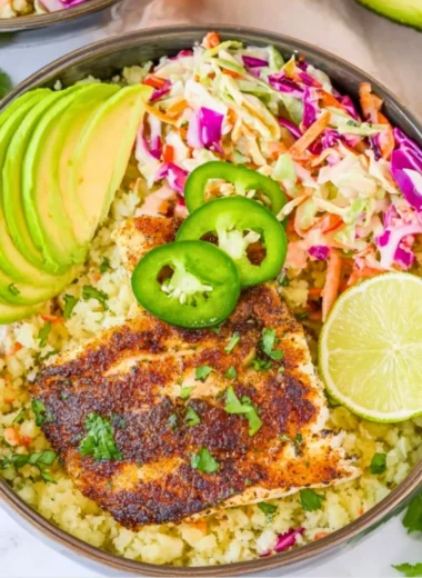 Healthy low carb fish taco bowls with fresh ingredients and vibrant toppings