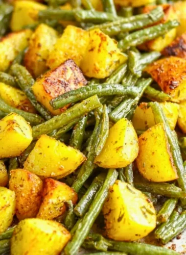 Delicious oven-roasted potatoes and green beans served on a plate
