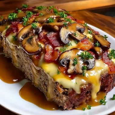 Delicious Swiss Bacon Mushroom Meatloaf served on a plate