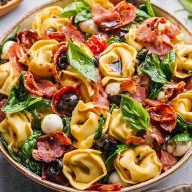 Delicious Tuscan Tortellini Salad with fresh vegetables and herbs