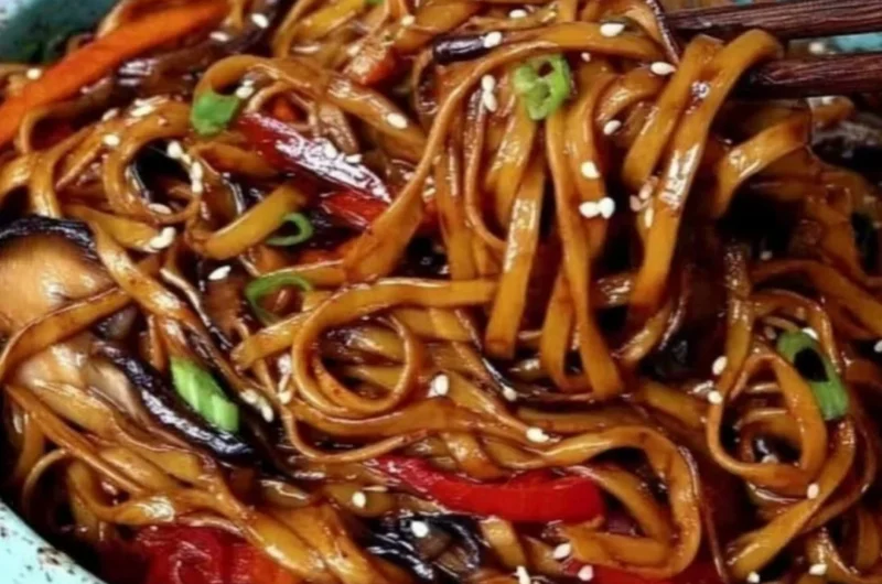 Colorful vegetable stir-fry noodles in a bowl, ready to serve for a healthy meal.