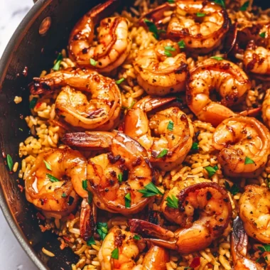 Cajun shrimp and rice skillet with vibrant vegetables in a pan