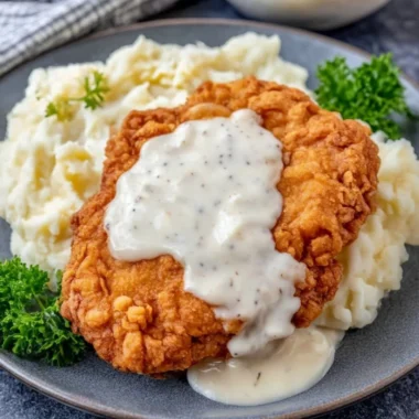 Plate of crispy Chicken Fried Chicken served with sides