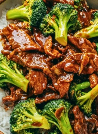 A plate of Chinese beef and broccoli stir-fry with vibrant vegetables