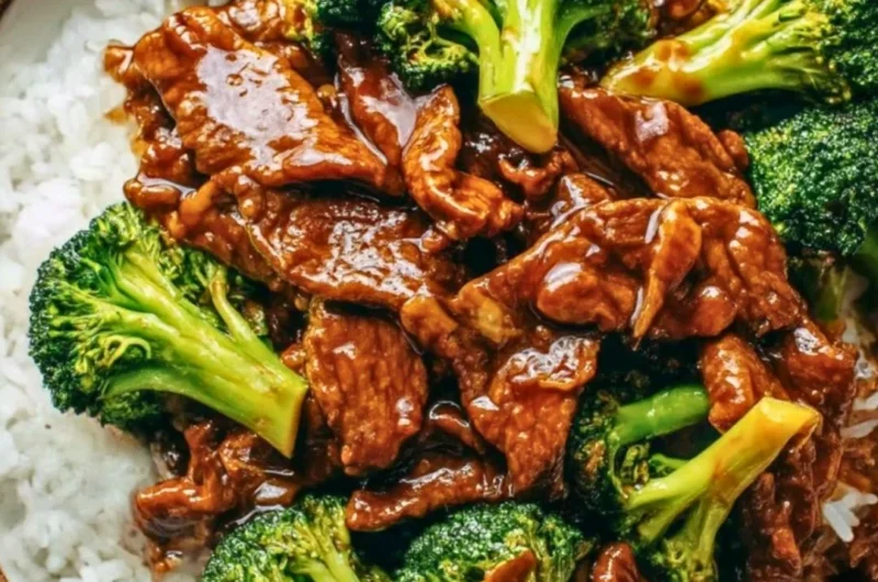 A plate of Chinese beef and broccoli stir-fry with vibrant vegetables