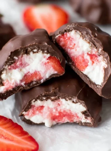 Chocolate Strawberry Yogurt Clusters drizzled with chocolate and topped with fresh strawberries.
