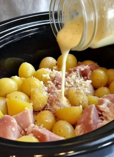 Crock Pot Parmesan Garlic Chicken served with potatoes on a plate