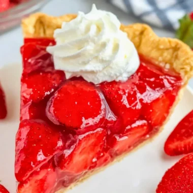 Delicious Easy Shoney's Strawberry Pie topped with fresh strawberries and whipped cream