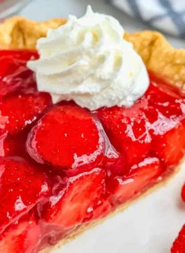 Delicious Easy Shoney's Strawberry Pie topped with fresh strawberries and whipped cream