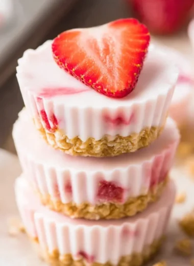 Frozen strawberry yogurt bites on a colorful plate, perfect for a healthy snack