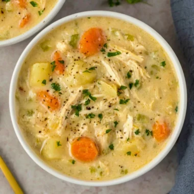 High protein chicken pot pie soup in a rustic bowl