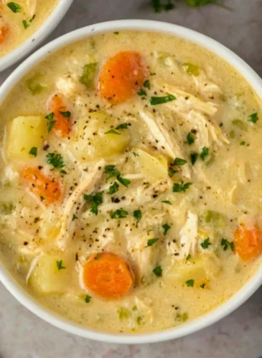 High protein chicken pot pie soup in a rustic bowl