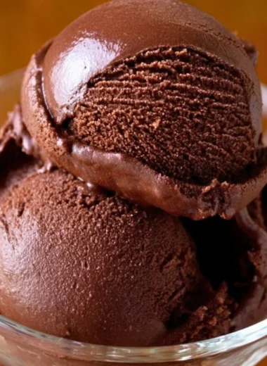 Delicious homemade chocolate sorbet served in a bowl with chocolate shavings