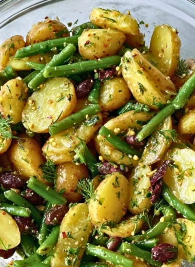 Potato and green bean salad with Kalamata olives served in a bowl