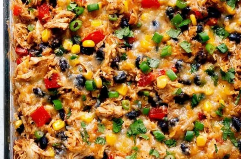 Delicious protein burrito casserole topped with cheese and fresh ingredients