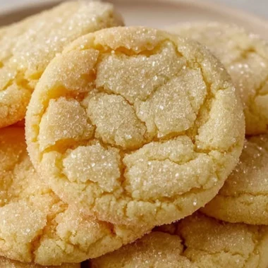 Freshly baked soft and chewy sugar cookies on a cooling rack
