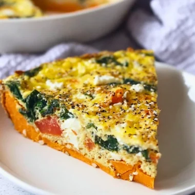 Spinach Goat Cheese Quiche with Sweet Potato Crust on a white plate