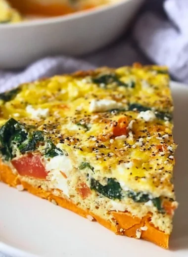 Spinach Goat Cheese Quiche with Sweet Potato Crust on a white plate