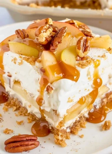 Delicious Apple Delight dessert with layers of graham cracker crust and creamy filling.