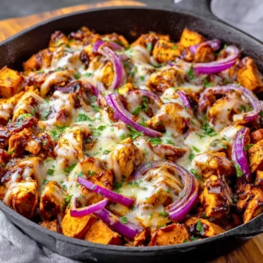 BBQ chicken sweet potato skillet in a pan, garnished and ready to serve