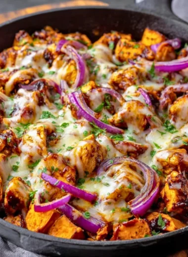 BBQ chicken sweet potato skillet in a pan, garnished and ready to serve