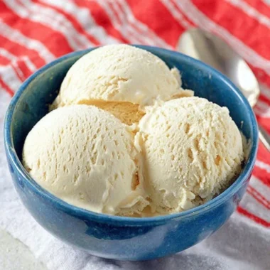 Delicious Cold Stone cake batter ice cream in a bowl with sprinkles.
