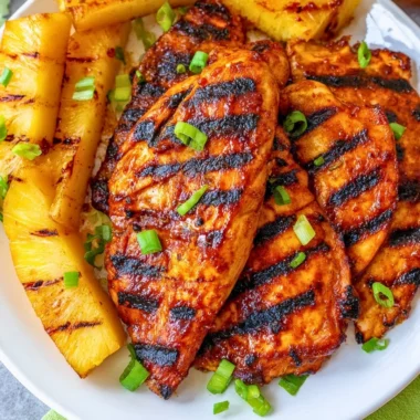 Delicious grilled Aloha Chicken garnished with pineapple and herbs