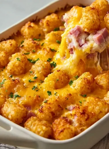 Delicious ham and tater tot casserole served in a baking dish