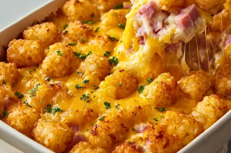 Delicious ham and tater tot casserole served in a baking dish