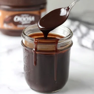 Delicious homemade hot fudge drizzling over ice cream and desserts