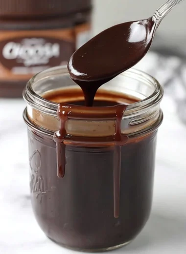 Delicious homemade hot fudge drizzling over ice cream and desserts