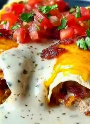 Jalapeño popper cheesy chicken enchiladas with creamy sauce and spices