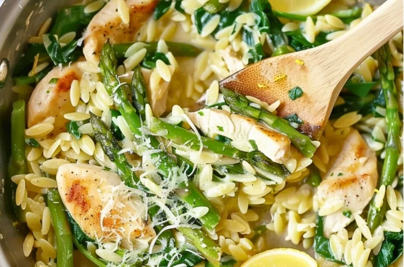 One Pot Lemon Chicken Orzo dish garnished with herbs and lemon slices