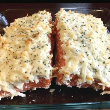 Baked salmon fillet with mayo, Parmesan and herb crust on a plate