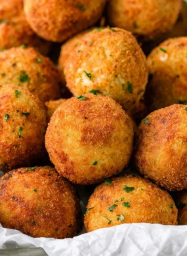 Delicious cheesy rice balls (Arancini) served as a crispy appetizer.