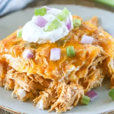 Delicious chicken enchilada casserole served with toppings